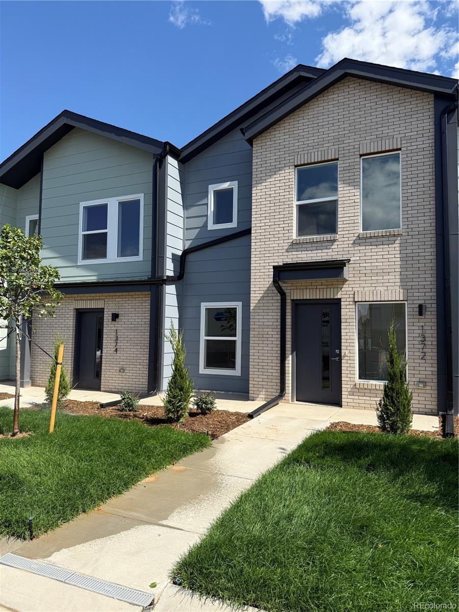 1304 Akron Street Aurora, CO 80010 - Photo 28 of 28 a front view of a house with a yard