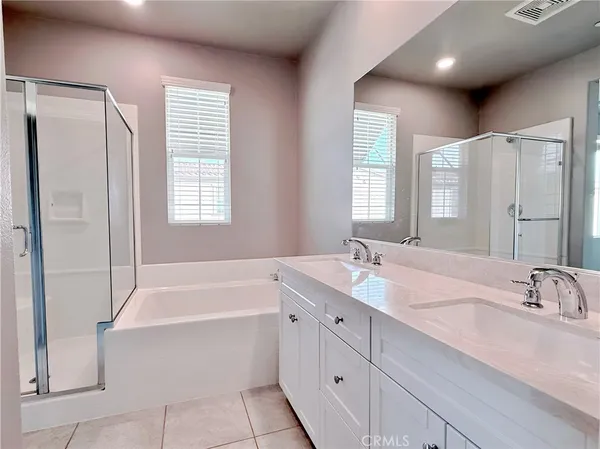a bathroom with a granite countertop sink mirror bathtub and shower