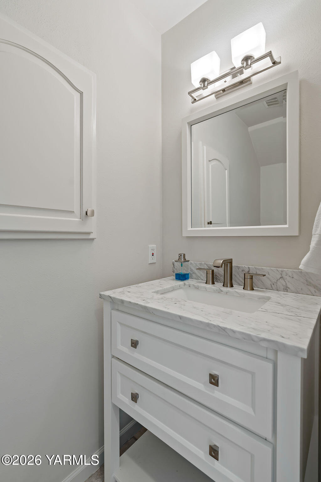 6810 Ravens Gate Way Yakima, WA 98908 - Photo 17 of 49 a bathroom with a sink vanity and mirror
