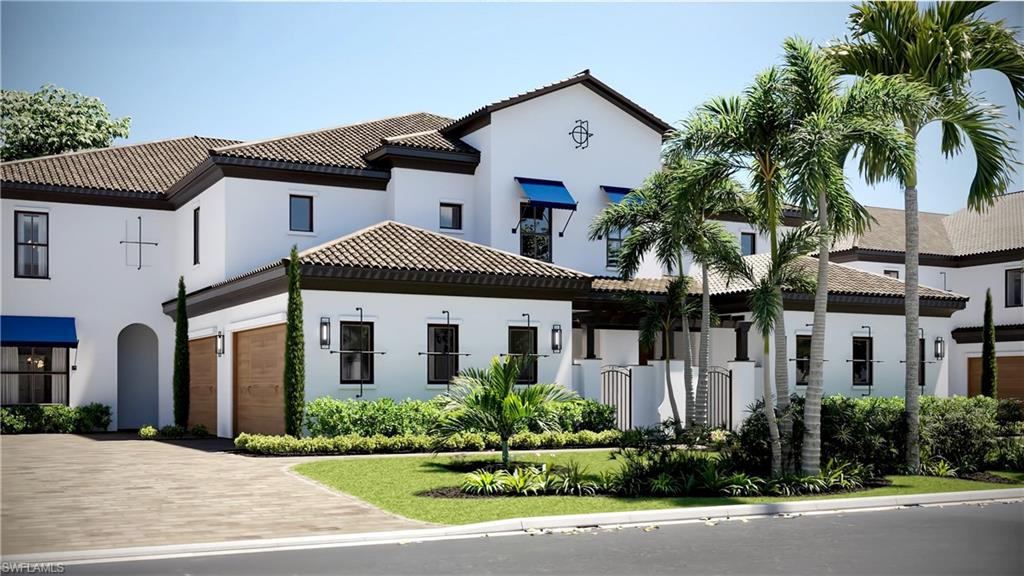 19781 Marino Lake Circle, Unit B4101 Miromar Lakes, FL 33913 - Photo 1 of 44 a front view of a house with a garden