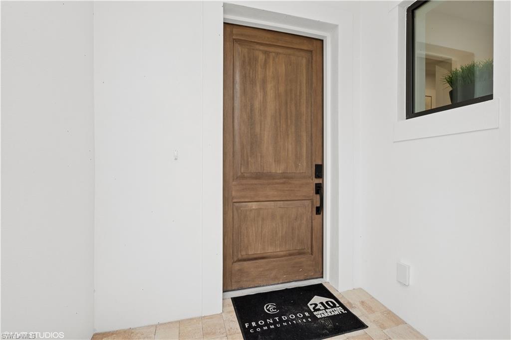 19781 Marino Lake Circle, Unit B4101 Miromar Lakes, FL 33913 - Photo 2 of 44 a picture of a door