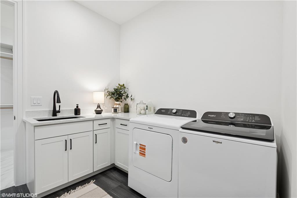 19781 Marino Lake Circle, Unit B4101 Miromar Lakes, FL 33913 - Photo 27 of 44 a utility room with sink dryer and washer