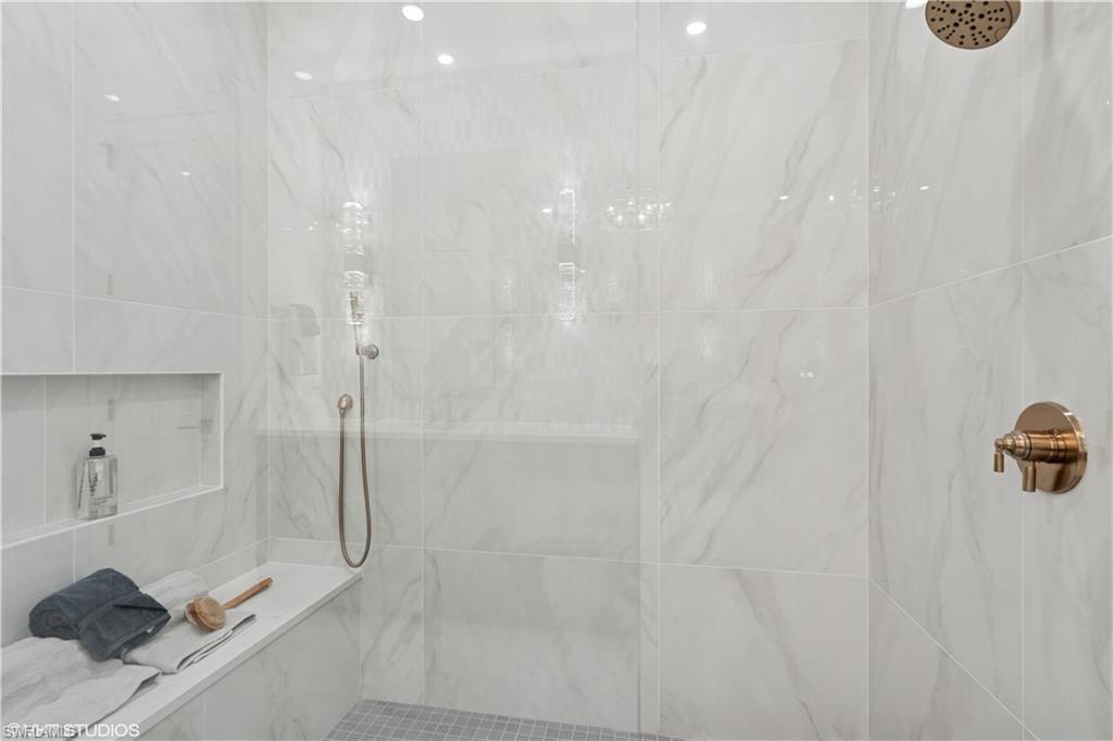 19781 Marino Lake Circle, Unit B4101 Miromar Lakes, FL 33913 - Photo 30 of 44 a bathroom with a shower