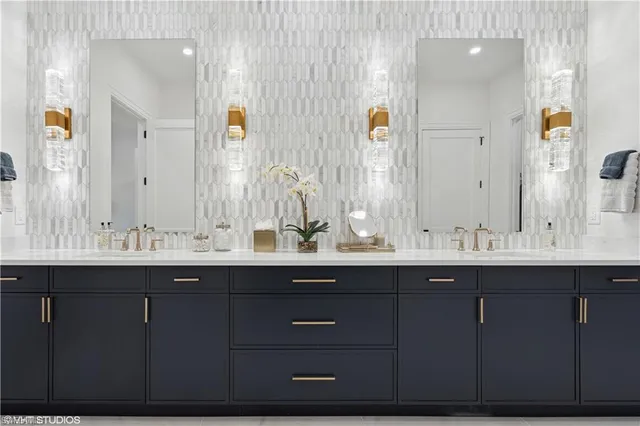 a bathroom with a double vanity sink and a mirror