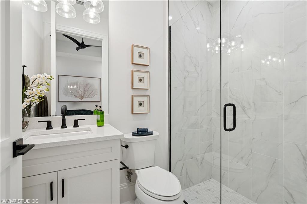 19781 Marino Lake Circle, Unit B4101 Miromar Lakes, FL 33913 - Photo 44 of 44 a bathroom with a sink toilet and shower