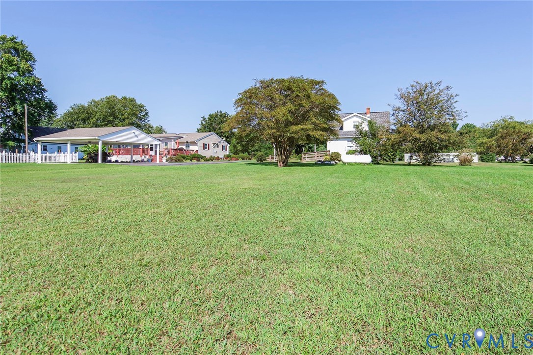 4912 Water View Road Water View, VA 23180 - Photo 10 of 42 Expansive lawn with mature trees, white picket fen
