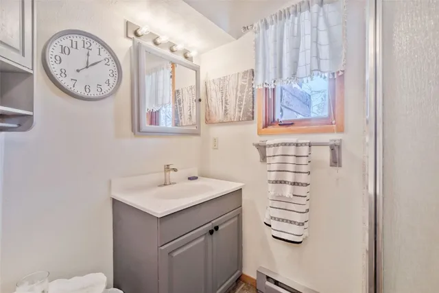 a view of a green field with an ocean view