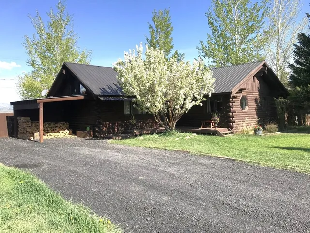 a view of house with yard