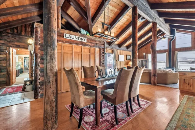 a view of a dining room with furniture wooden floor and a rug