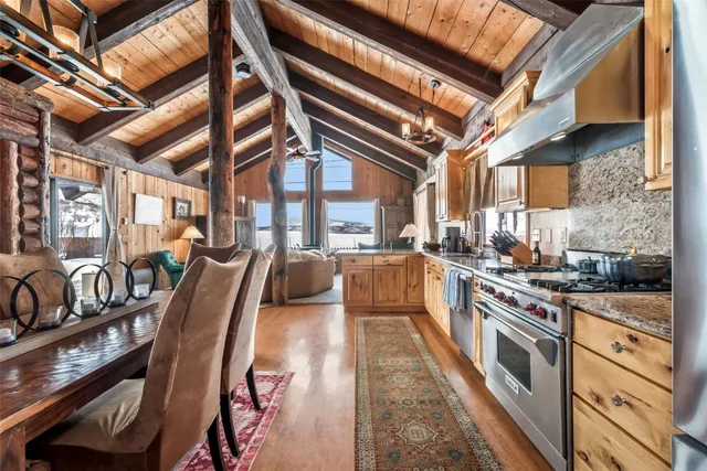 a large kitchen with cabinets and a stove