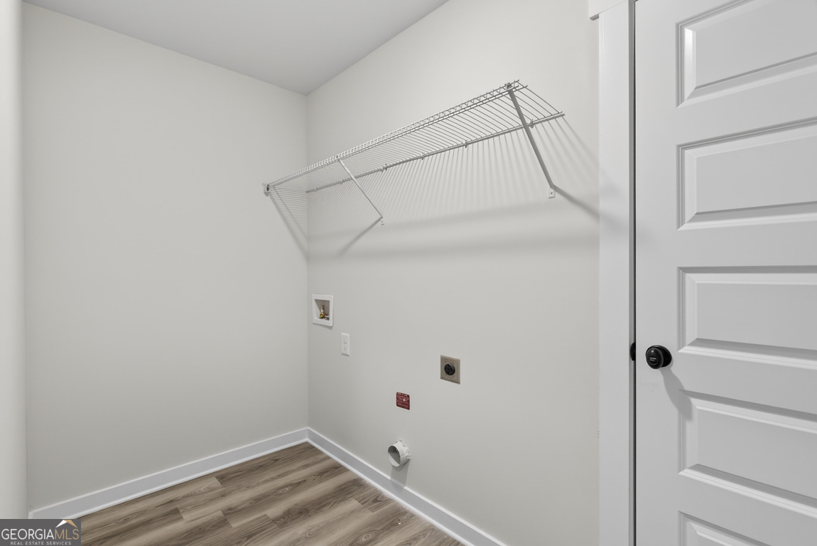 140 Chad Walk, Unit 57 Statham, GA 30666 - Photo 16 of 36 a view of a room with racks on the wall