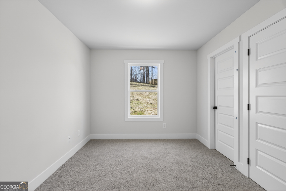 140 Chad Walk, Unit 57 Statham, GA 30666 - Photo 18 of 36 a view of an empty room and window