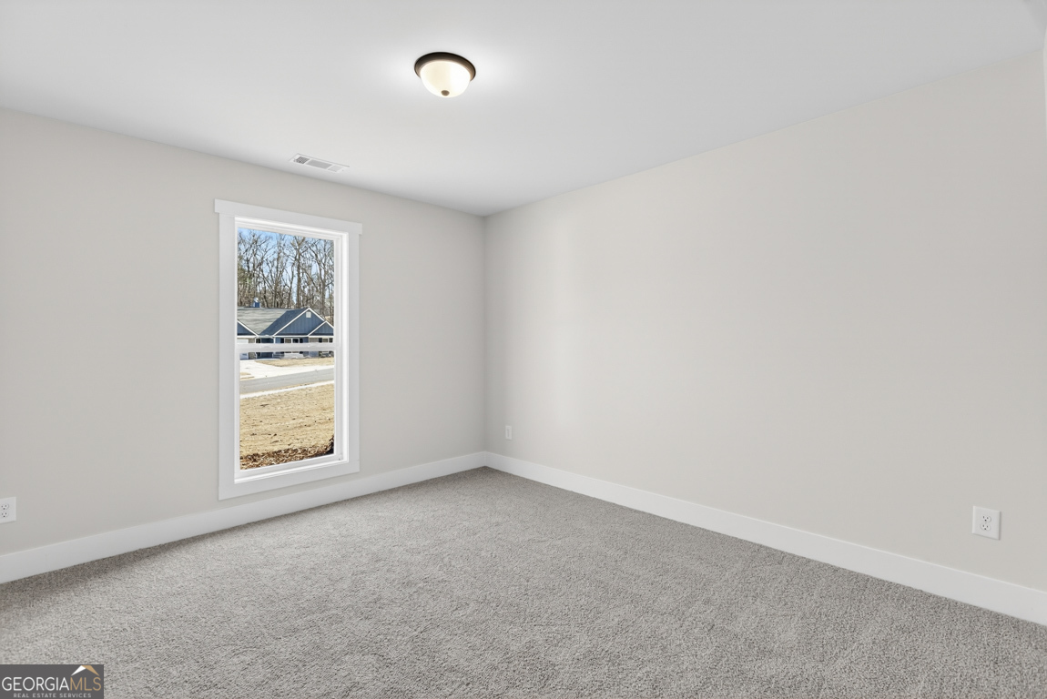 140 Chad Walk, Unit 57 Statham, GA 30666 - Photo 21 of 36 an empty room with a window