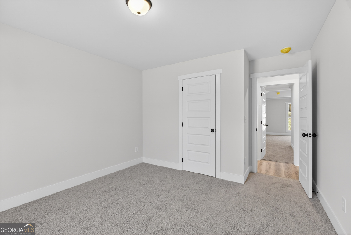 140 Chad Walk, Unit 57 Statham, GA 30666 - Photo 22 of 36 a view of an empty room and closet area