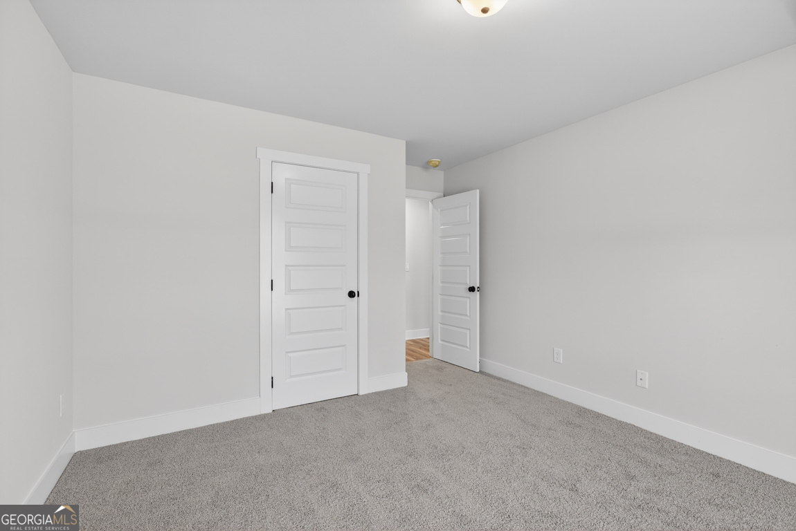 140 Chad Walk, Unit 57 Statham, GA 30666 - Photo 23 of 36 a view of an empty room and closet area