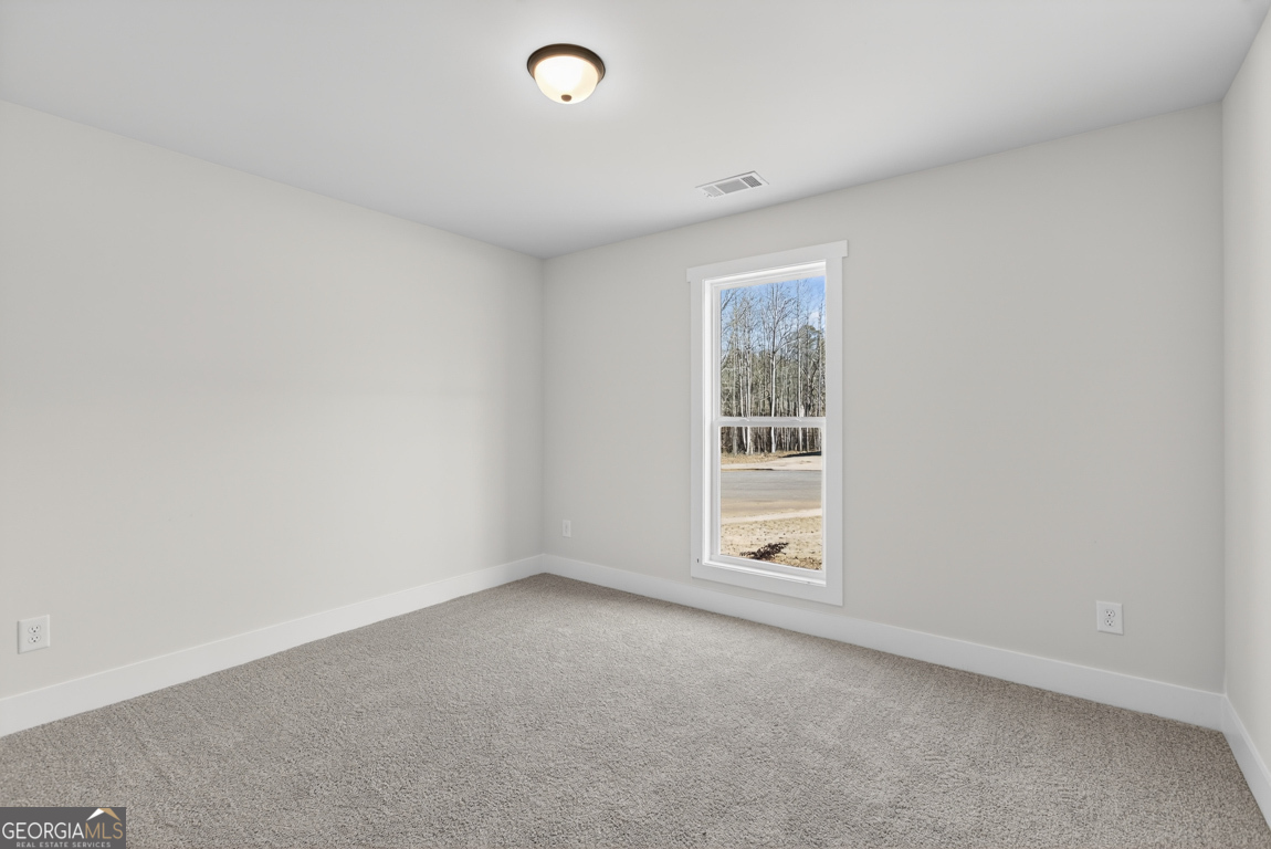 140 Chad Walk, Unit 57 Statham, GA 30666 - Photo 24 of 36 an empty room with a window