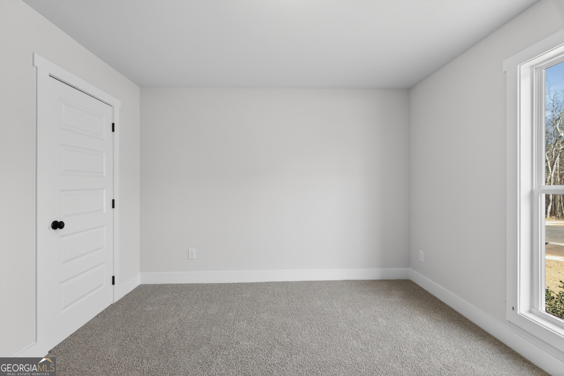 140 Chad Walk, Unit 57 Statham, GA 30666 - Photo 26 of 36 a view of an empty room and a window