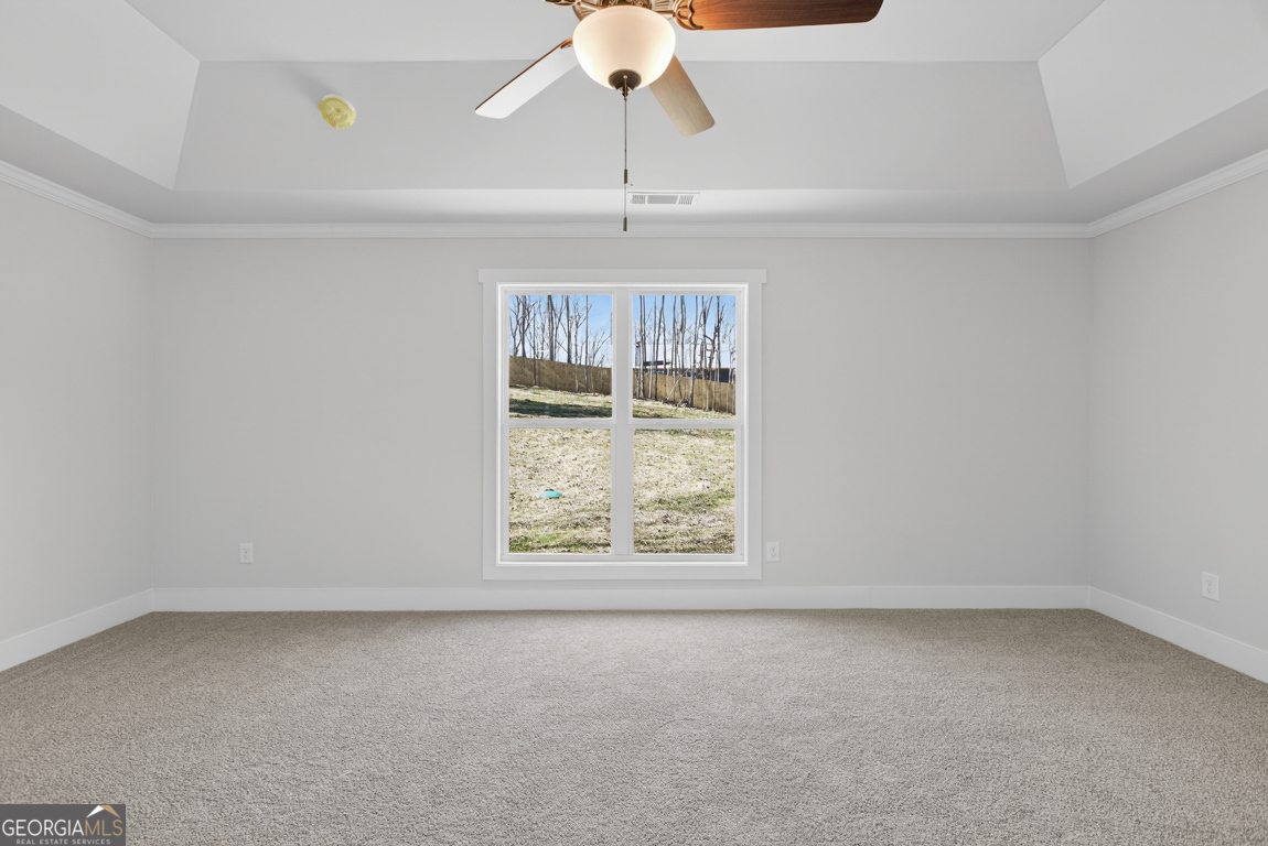140 Chad Walk, Unit 57 Statham, GA 30666 - Photo 28 of 36 an empty room with a window and a ceiling fan