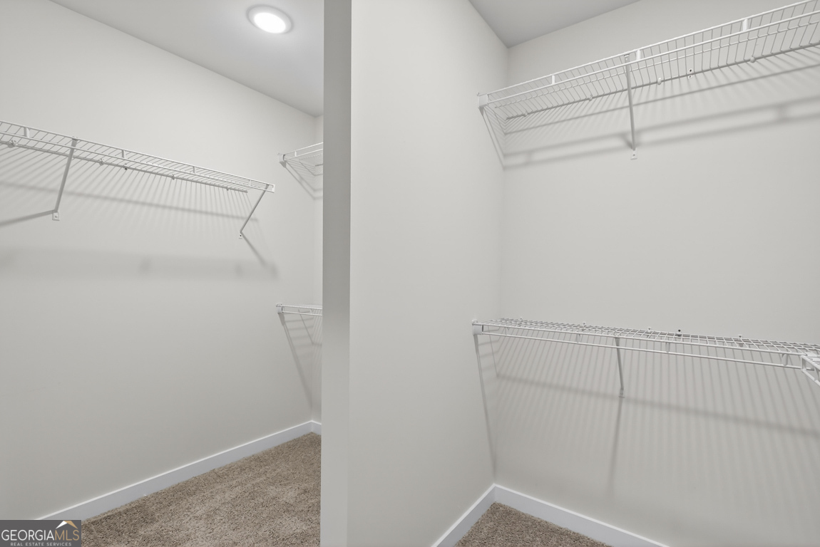 140 Chad Walk, Unit 57 Statham, GA 30666 - Photo 30 of 36 a view of a room with racks on the wall