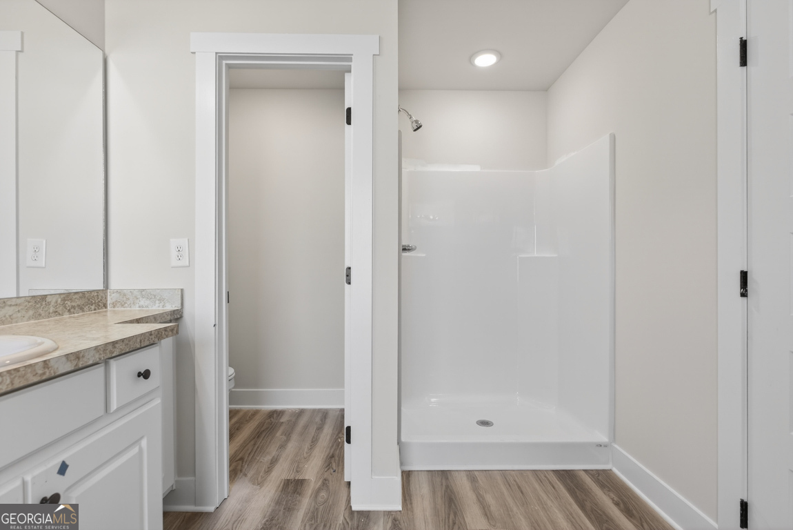 140 Chad Walk, Unit 57 Statham, GA 30666 - Photo 33 of 36 a bathroom with a granite countertop sink