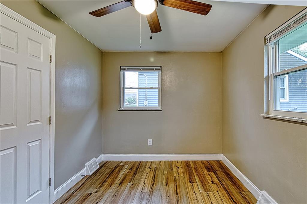 613 Virginia Avenue Rochester, PA 15074 - Photo 12 of 21 a view of a room with wooden floor fan and windows