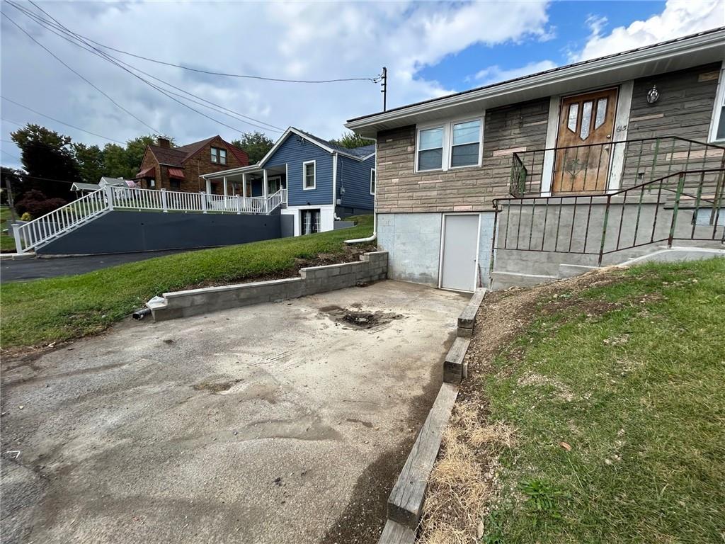 613 Virginia Avenue Rochester, PA 15074 - Photo 20 of 21 a front view of a house with a yard