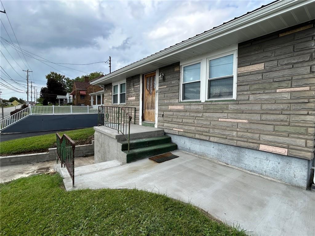 613 Virginia Avenue Rochester, PA 15074 - Photo 2 of 21 a front view of a house with garden