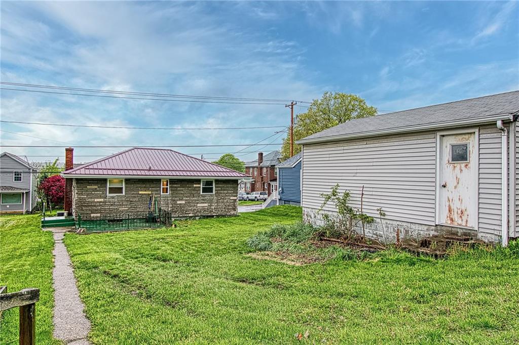613 Virginia Avenue Rochester, PA 15074 - Photo 5 of 21 a view of a house with a garden