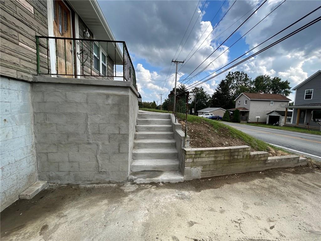 613 Virginia Avenue Rochester, PA 15074 - Photo 6 of 21 a view of a yard with car parked