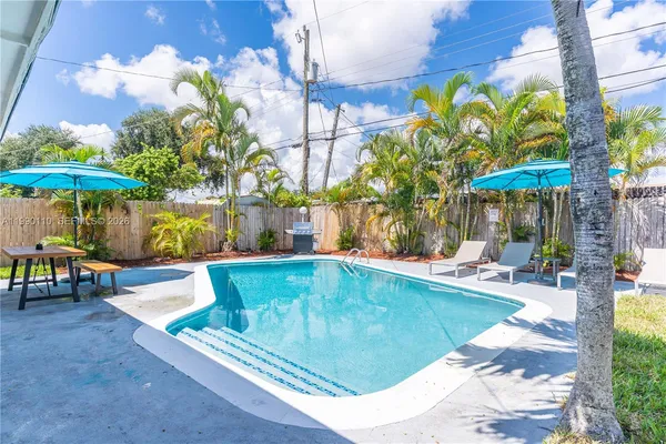 a view of a swimming pool with a patio