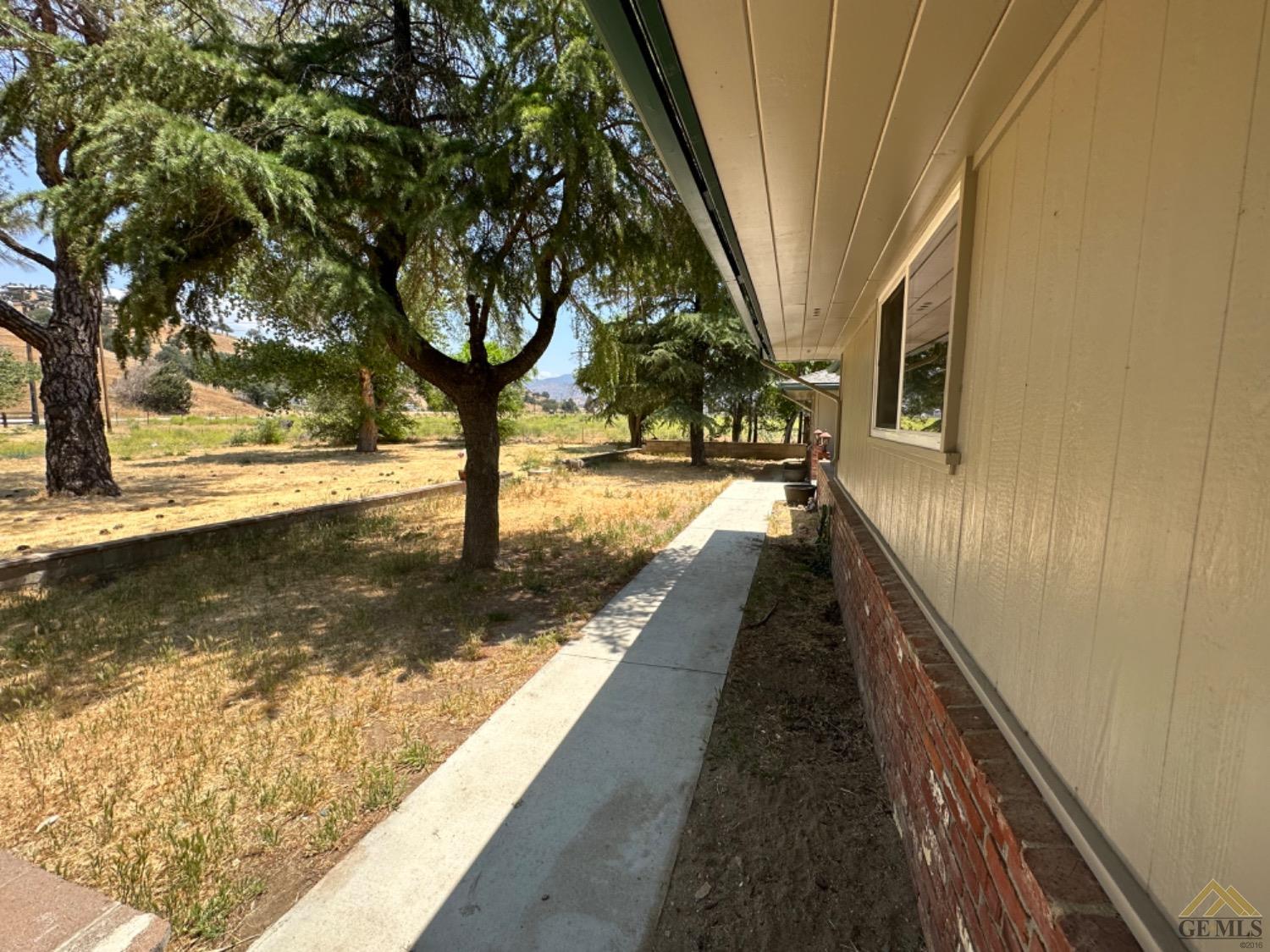 Undisclosed Address Caliente, CA 93518 - Photo 14 of 59 a view of a pathway of a house with a yard