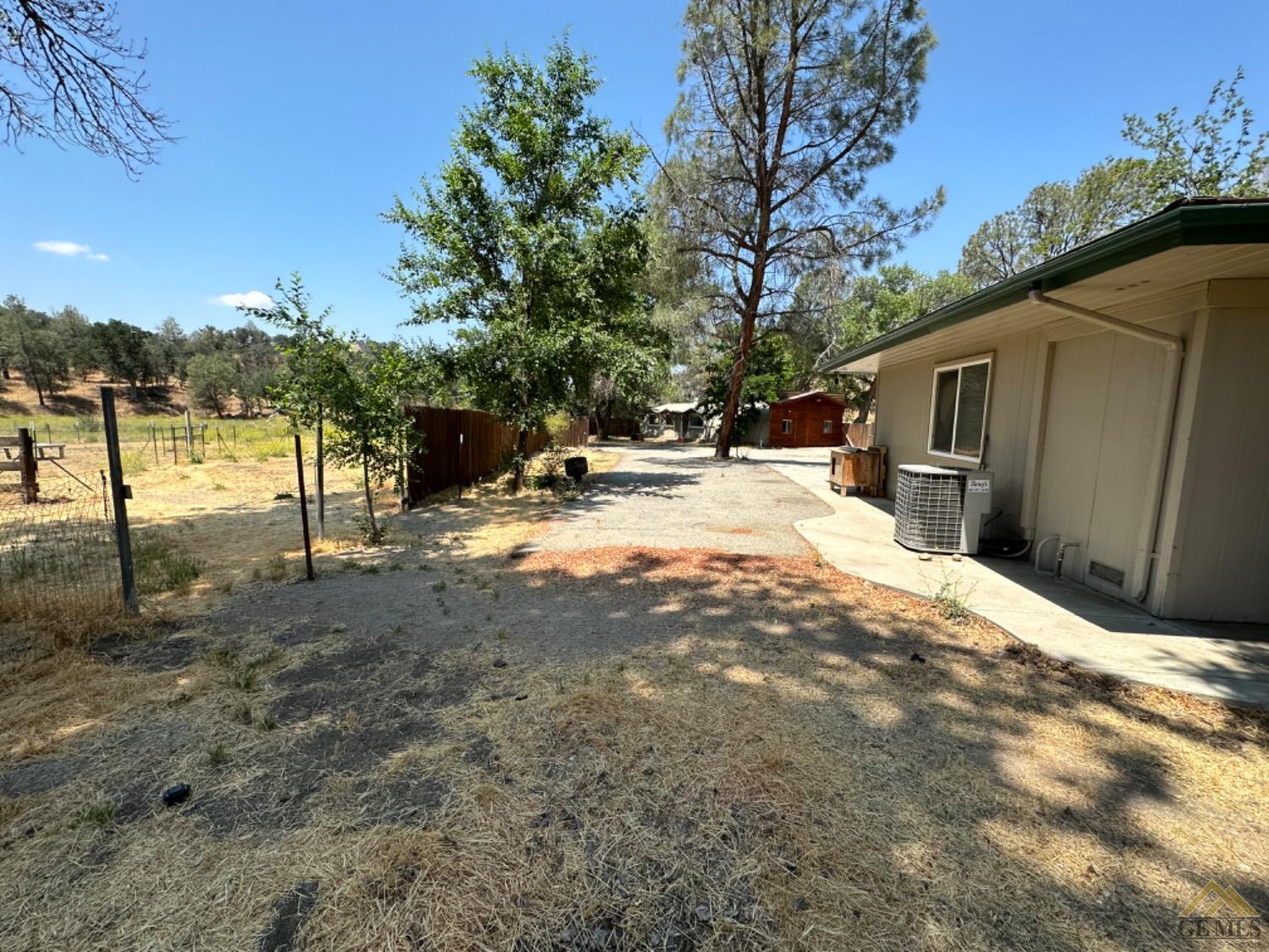 Undisclosed Address Caliente, CA 93518 - Photo 17 of 59 a backyard of a house with table and chairs