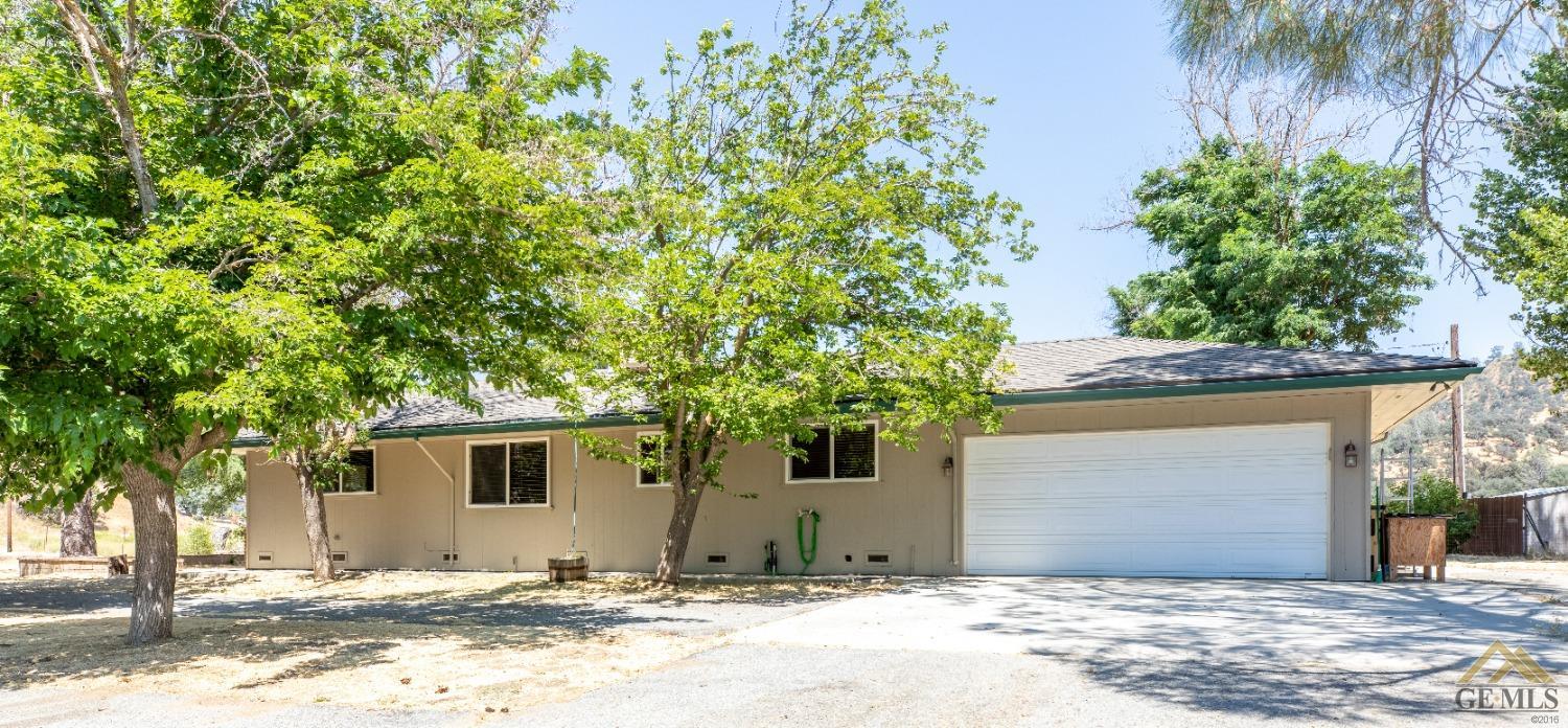 Undisclosed Address Caliente, CA 93518 - Photo 32 of 59 a front view of a house with a tree