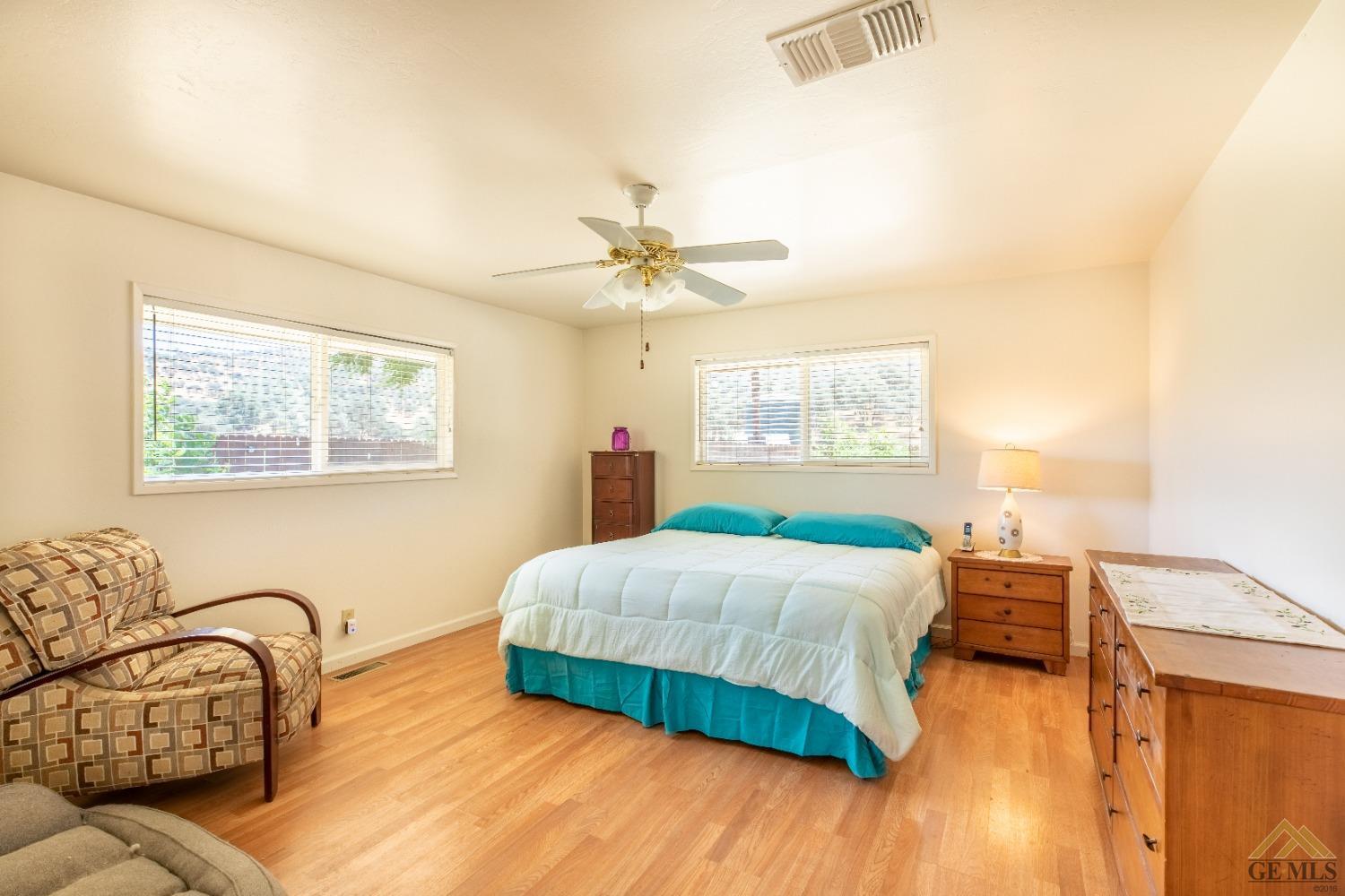 Undisclosed Address Caliente, CA 93518 - Photo 44 of 59 a bedroom with a bed and wooden floor