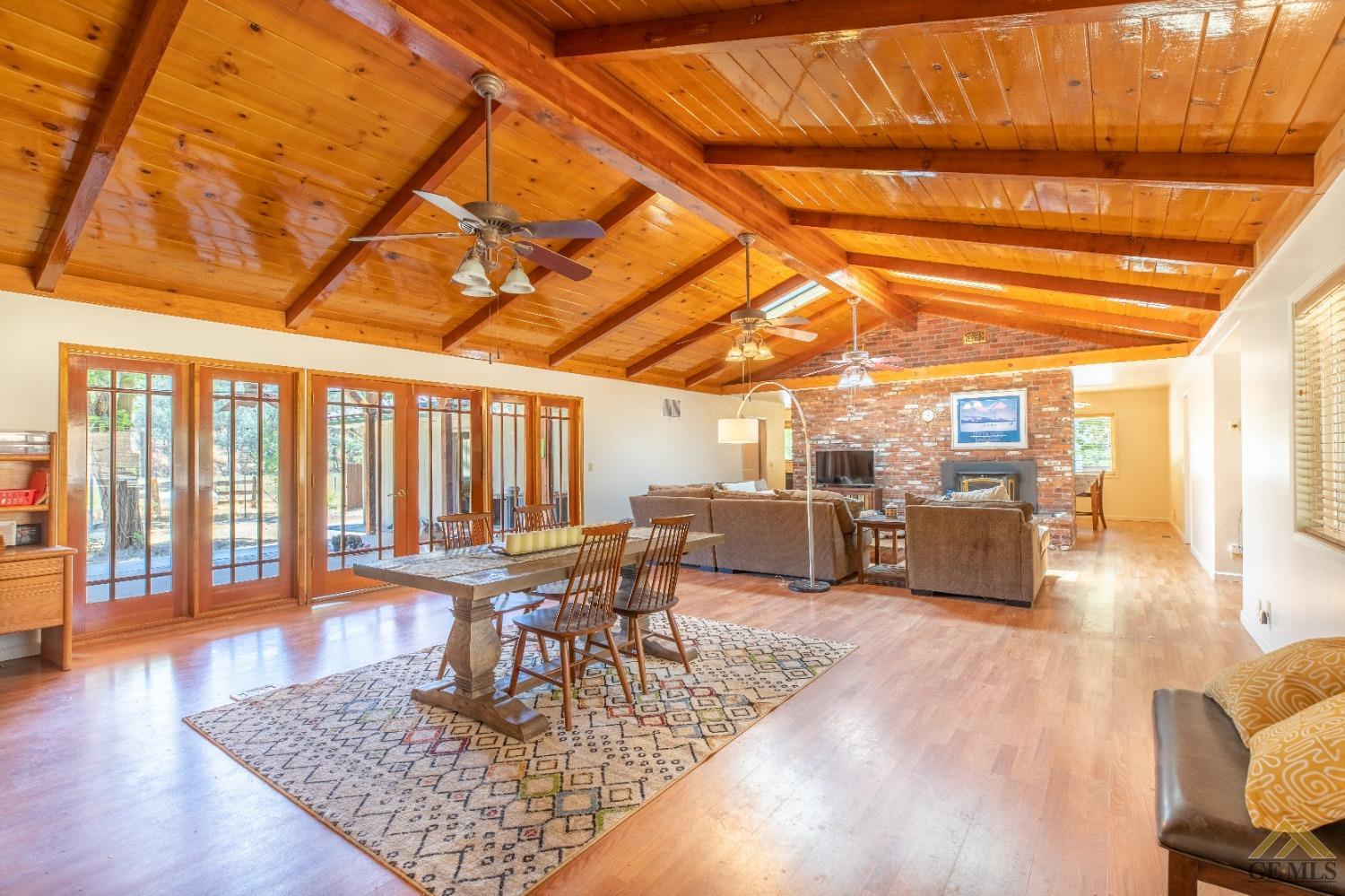 Undisclosed Address Caliente, CA 93518 - Photo 49 of 59 a dining room with wooden floor a table and chairs