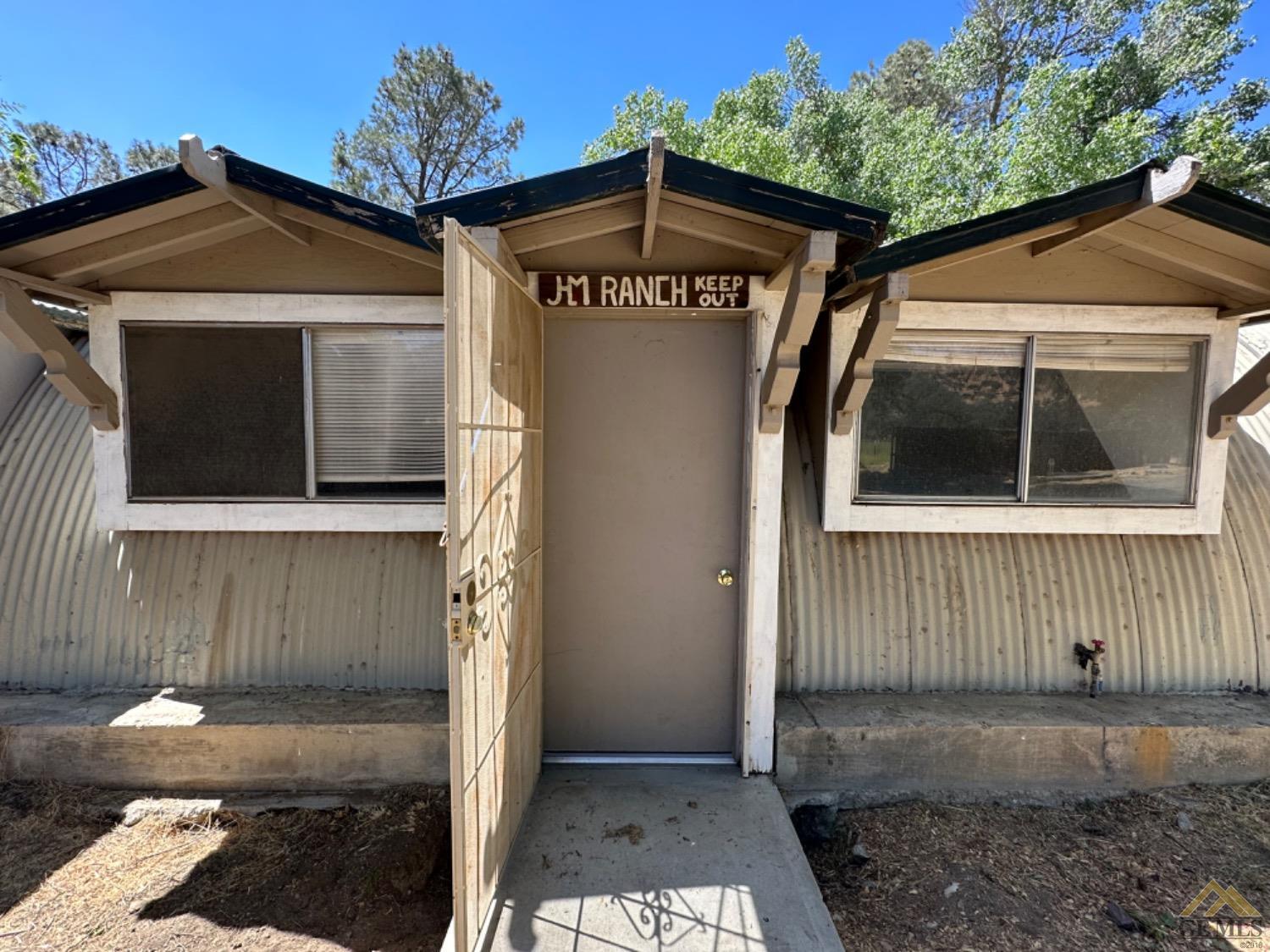 Undisclosed Address Caliente, CA 93518 - Photo 53 of 59 a front view of a house with a yard