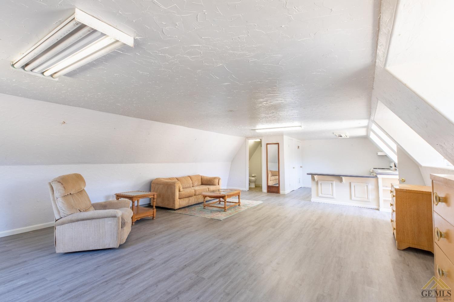 Undisclosed Address Caliente, CA 93518 - Photo 54 of 59 a living room with furniture and a wooden floor