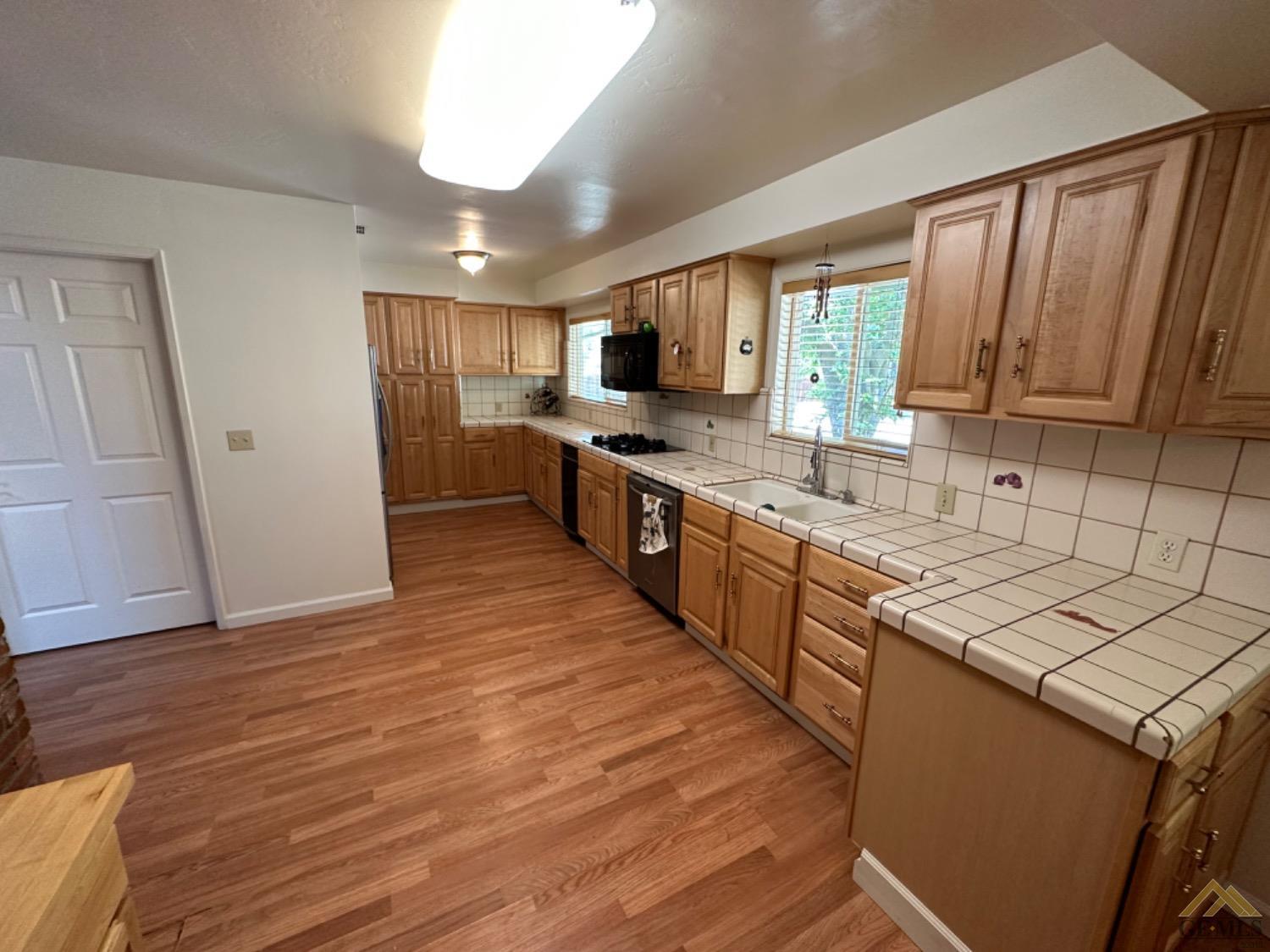 Undisclosed Address Caliente, CA 93518 - Photo 7 of 59 a large kitchen with stainless steel appliances granite countertop a stove a sink and a refrigerator