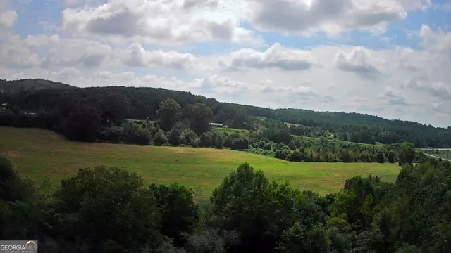 a view of mountain with lake view