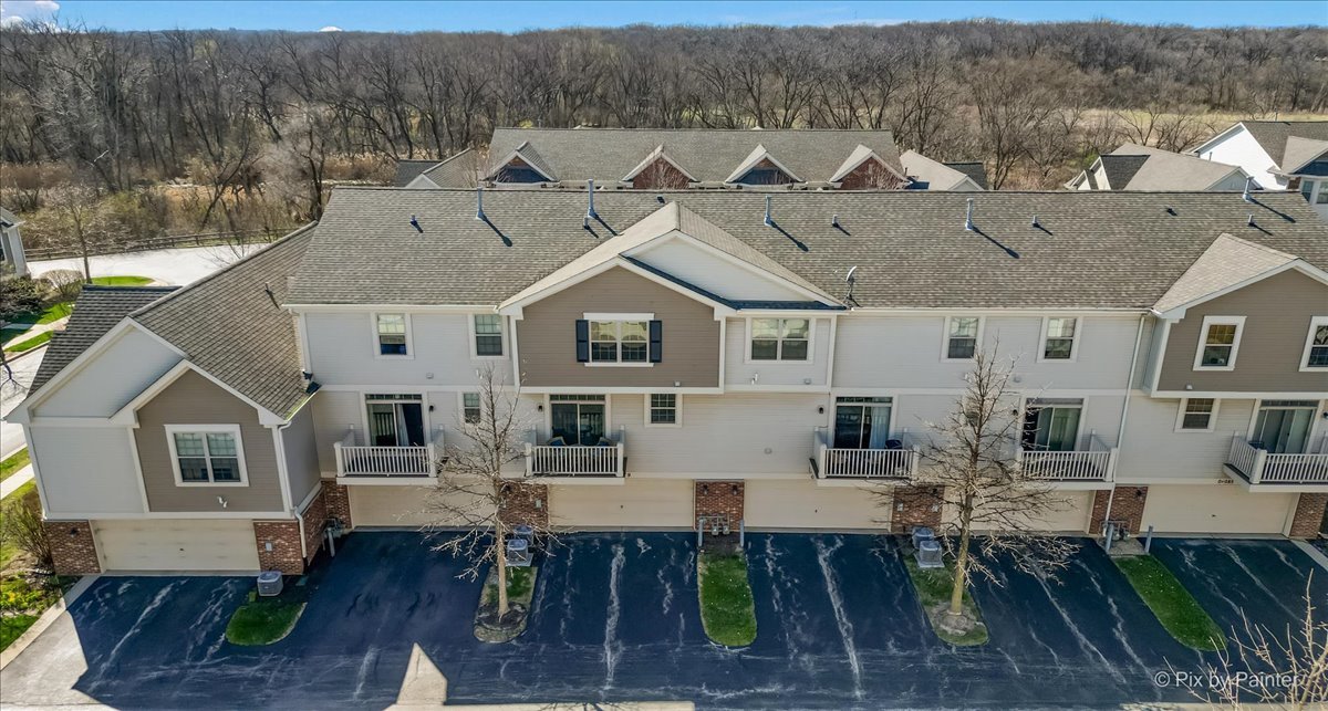 N079 Vermont Court Winfield, IL 60190 - Photo 28 of 33 a aerial view of a house with table and chairs