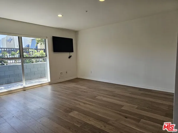 a view of a livingroom with wooden floor