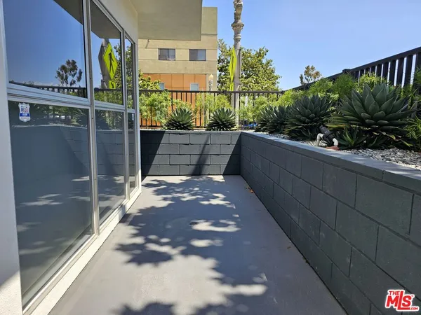 a view of balcony with a forest