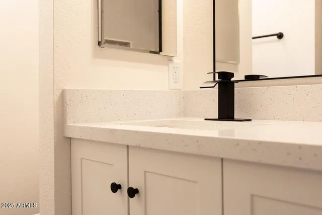 a stove top oven sitting inside of a kitchen