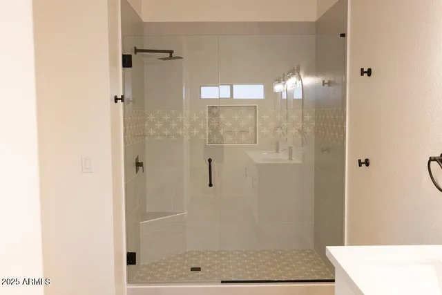 a bathroom with a sink and a mirror