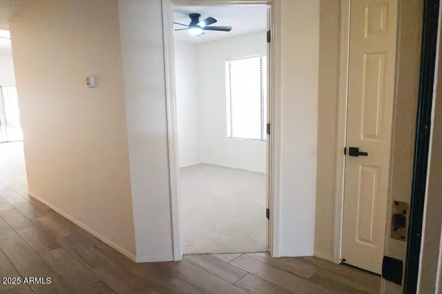 a white toilet sitting next to a shower