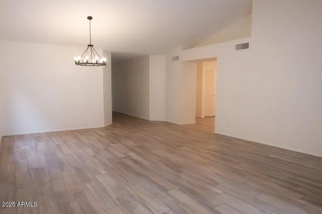 a kitchen with stainless steel appliances a stove microwave and sink