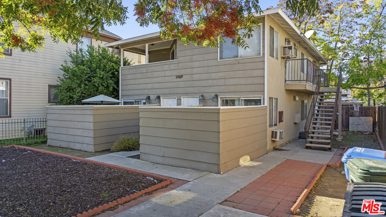 3469 Lime Street Riverside, CA 92501 - Photo 4 of 9 a view of a house with a yard