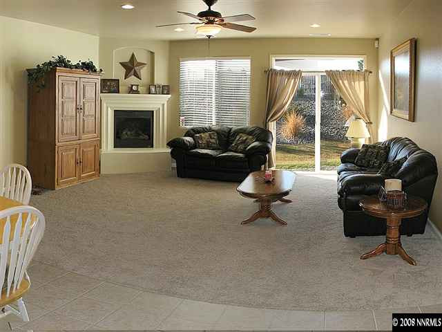 2372 Copper Springs Drive Reno, NV 89521 - Photo 5 of 9 a living room with furniture and a fireplace