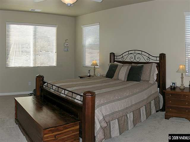 2372 Copper Springs Drive Reno, NV 89521 - Photo 6 of 9 a bedroom with a bed and a window