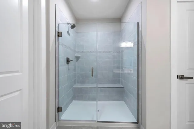 a spacious bathroom with a double vanity sink mirror and toilet
